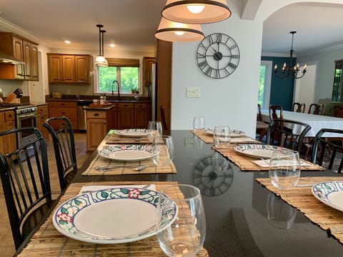 Kitchen island features beverage fridge
