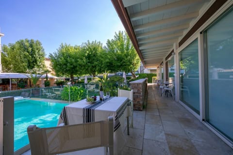 A comfortable table is on the balcony for relaxing breakfat