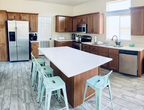 Kitchen with island seating, electric stove