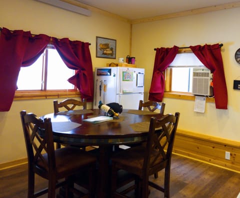 Bar height table, window ac, and fridge/freezer