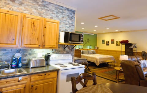 Kitchen with toaster, microwave, and oven. 