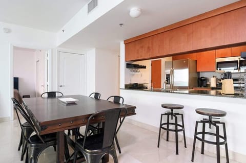 Start your day at the breakfast bar or whip up meals in a sleek kitchen with stainless steel appliances. Ideal for extended stays and foodie travelers.

