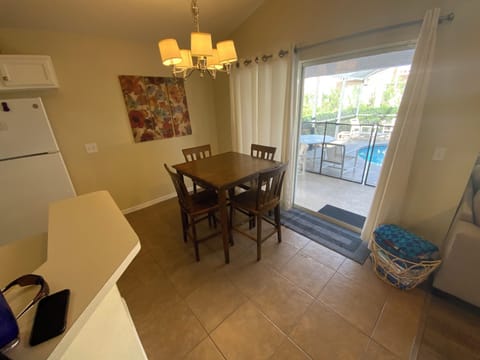Eat in Kitchen area leading to lanai and pool