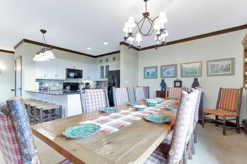 - Elegant dining area with mountain views and classic rustic décor   - Large wooden table for family-style meals and gatherings   - Perfect blend of alpine charm and comfort near Stratton