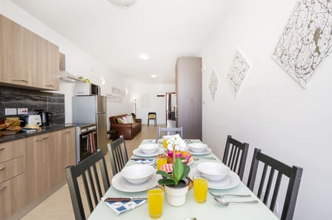 Fully equipped kitchen and dining area with panoramic views