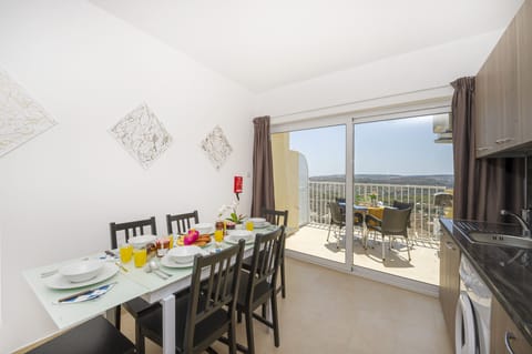 Fully equipped kitchen and dining area with panoramic views