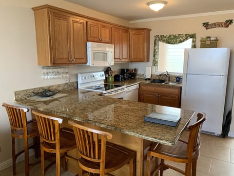 Full kitchen with granite counters
