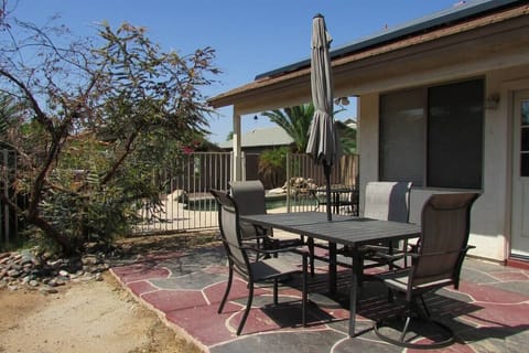 Private backyard with swimming pool, BBQ, and outdoor patio