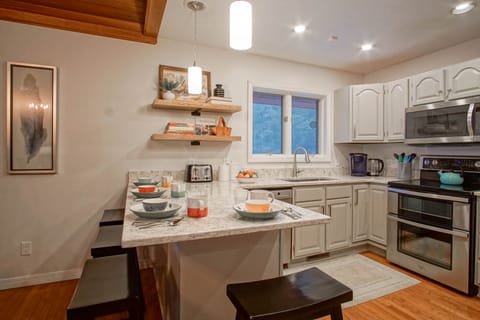 The kitchen bar has seating for 4.