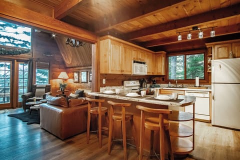 In addition to the dining area, there is also the kitchen bar which seats 3.