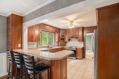The kitchen has a large breakfast bar.