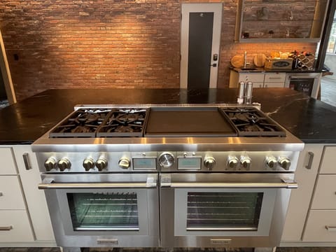 Brand new 60" gas range with two full sized ovens