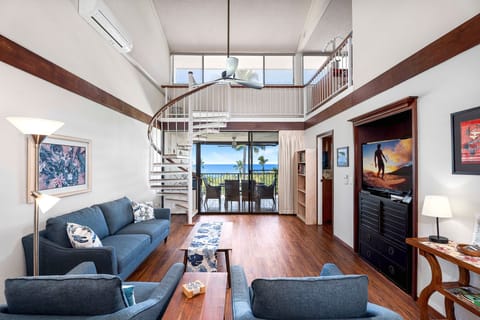 Floor to ceiling windows off the living room provide clear views of the ocean