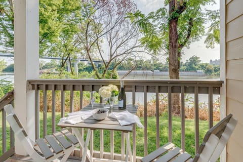 Watch the river traffic and party barges from your balcony