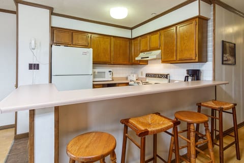 The kitchen bar seats 4.