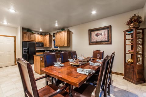 Enjoy family meals or group dinners at this elegant wooden dining table that seats 8 comfortably. Surrounded by tasteful decor and adjacent to a fully equipped kitchen, it's ideal for memorable gatherings and shared conversations.