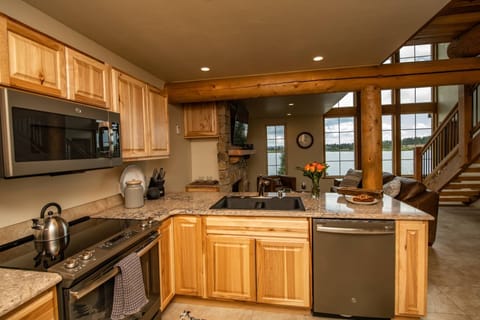 Kitchen boasts all granite counter tops and upgraded appliances.
