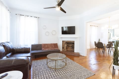 The living Room has a sleeper sofa and smart TV.