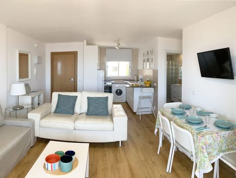 Living-dining room with direct access to the balcony, beach view, sofa bed, air conditioning and comfortable furniture