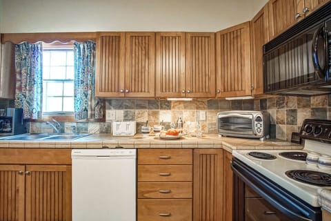 This kitchen has plenty of counter space to cook at.