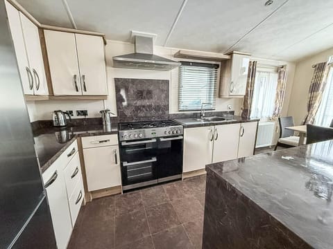 Spacious kitchen with modern appliances and ample counter space