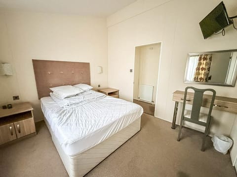 Bright and cozy bedroom with modern amenities and workspace