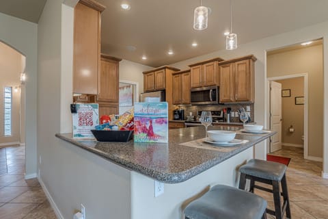 Elegant kitchen space with a breakfast bar, ideal for casual dining and socializing.