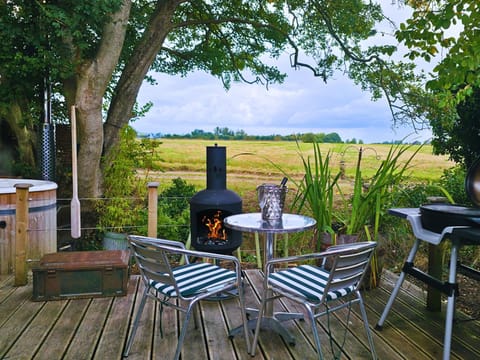 Private decking with outdoor sitting area, firepit, hot tub and electric BBQ