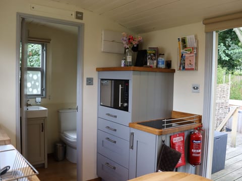 Double induction hob, combination microwave/oven/grill, kettle, toaster and fridge freezer.