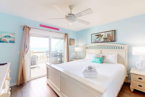 The owner suite features ocean views with a king bed, full en-suite bathroom and walk in closet