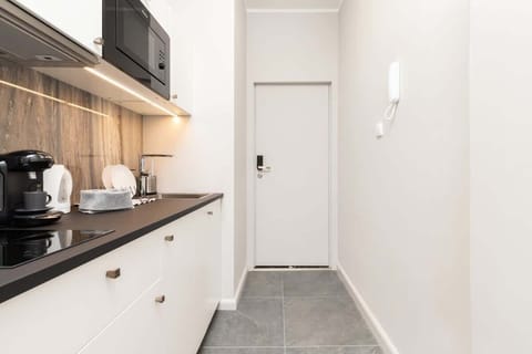 The kitchenette's practical layout maximizes space and functionality.