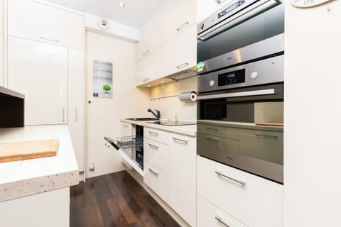 Modern kitchen with full equipment including an oven..
