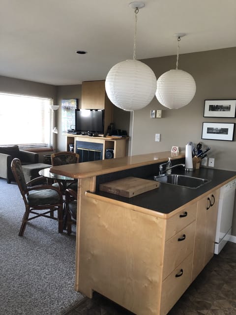 You come into the kitchen and look over the living room to the ocean