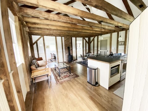 Upon entering the School House, large open space with kitchen to the right
