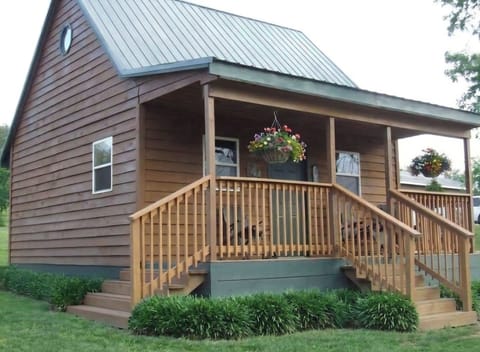 Exterior front porch with rocking chairs.