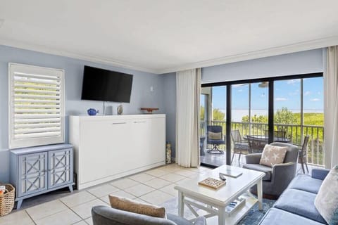 Picture of bay view from living room, with Twin XL sized murphy fold out bed under the flat screen TV