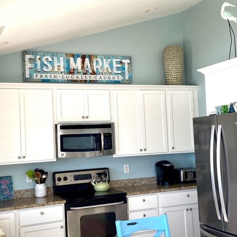 Kitchen area   Laundry Room & Powder Room to the right. 