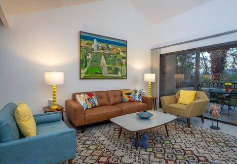 Living room with mid-century furnishings.  Comfort + Style = 🙂