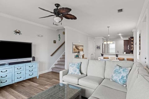 Open-concept dining area, living area and full kitchen.