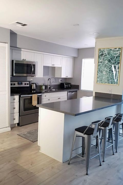 4 more can sit at kitchen island