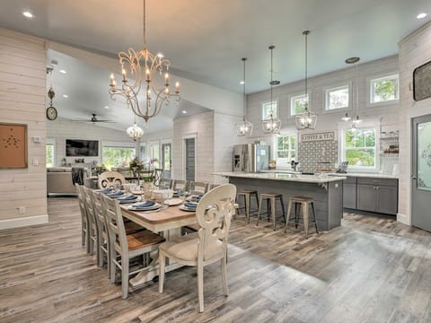 Kitchen with eating bar island and Dining room from Patio looking to Living room