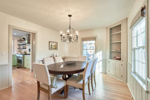 Dining room with seating for six, and the original paneling