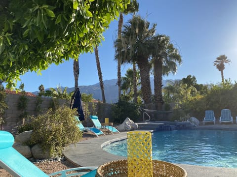 Enjoy the beautiful view of magical mountain ranges, lounging by the pool
