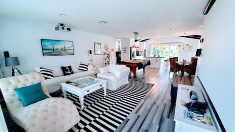 Entering the home you arrive in the Living room with Projector Screen