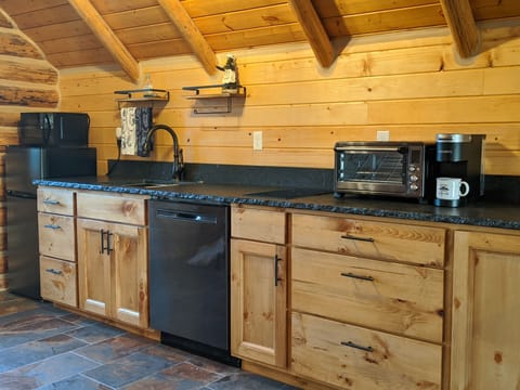 Kitchenette with stove top, spices and toaster oven 