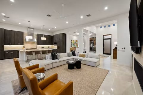 Open floor plan links kitchen, dining, and lounge for a connected stay