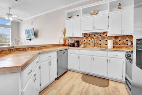 Spacious counters, stainless steel, and sunny vibes make cooking feel like a breeze.