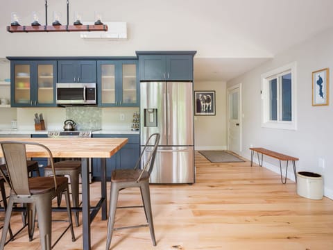 Original local artwork, locally-milled hardwood floors and new appliances. 