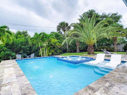 New in ground custom heated pool and spa with three deck jets and tanning ledge.