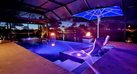 Pool, with fire bowls & ledge lounger furniture, with pool cooler & unbrellla